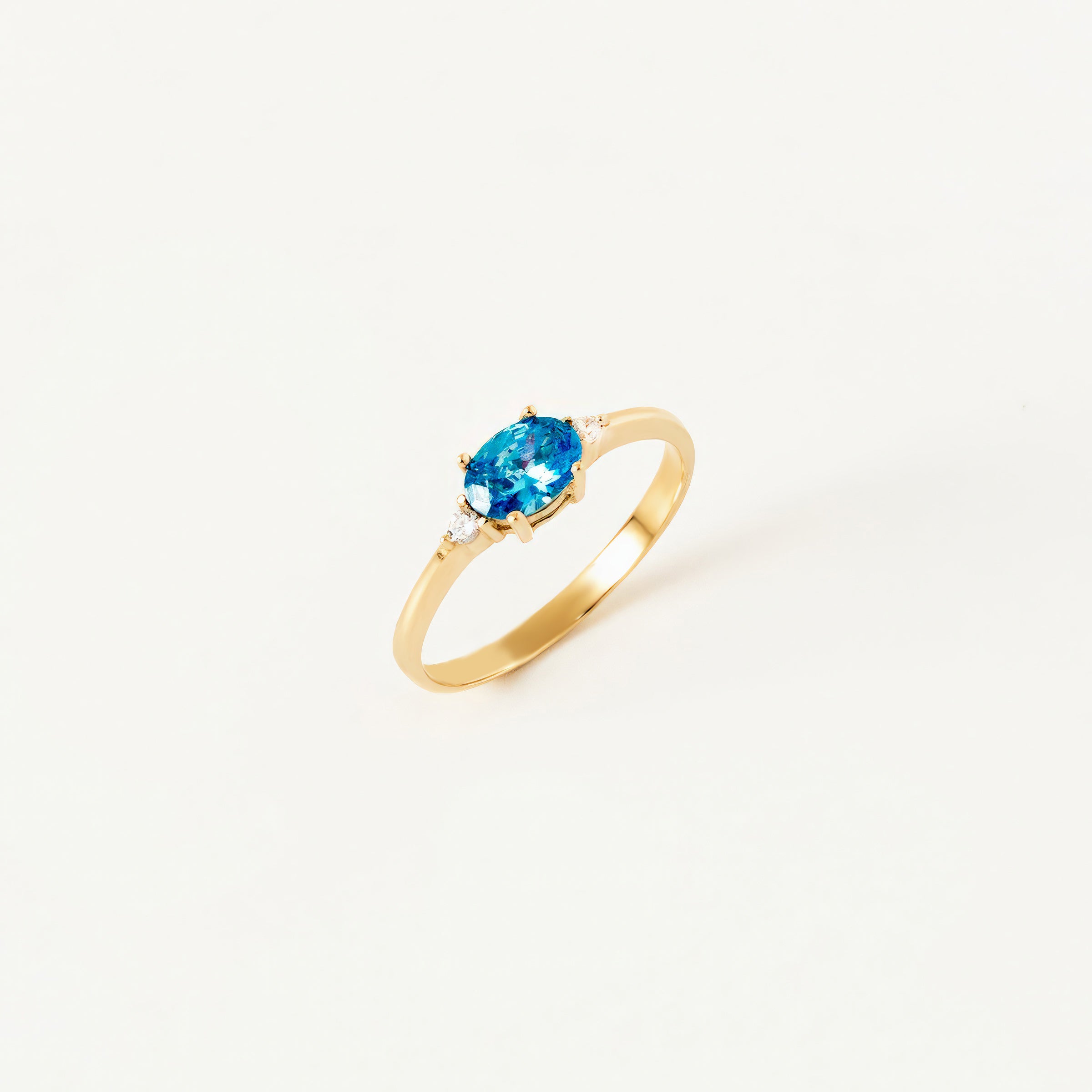 Oval Blue Topaz CZ Ring in 14K Gold