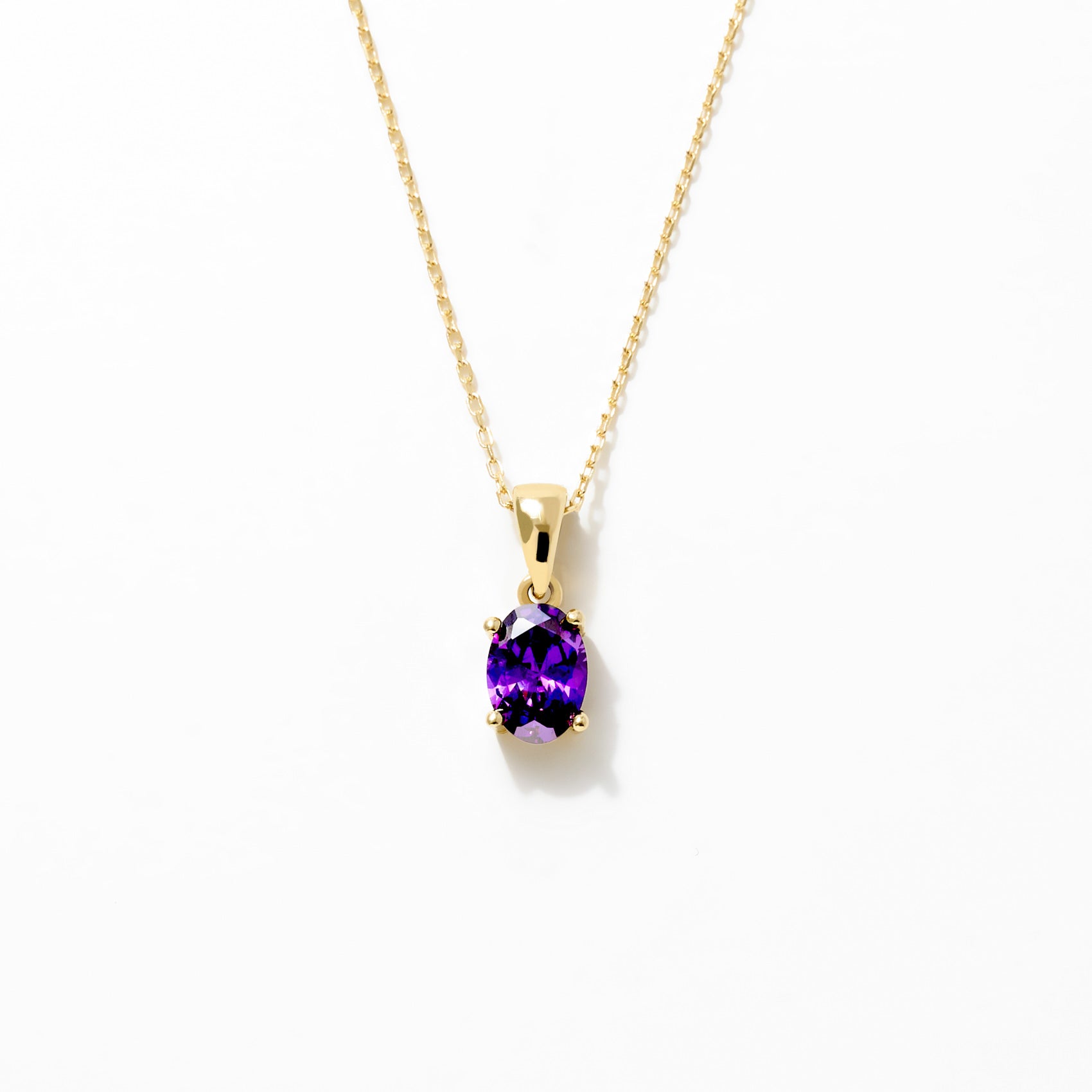 14K Gold Amethyst Pendant Necklace with an oval-cut purple amethyst on a delicate gold chain.